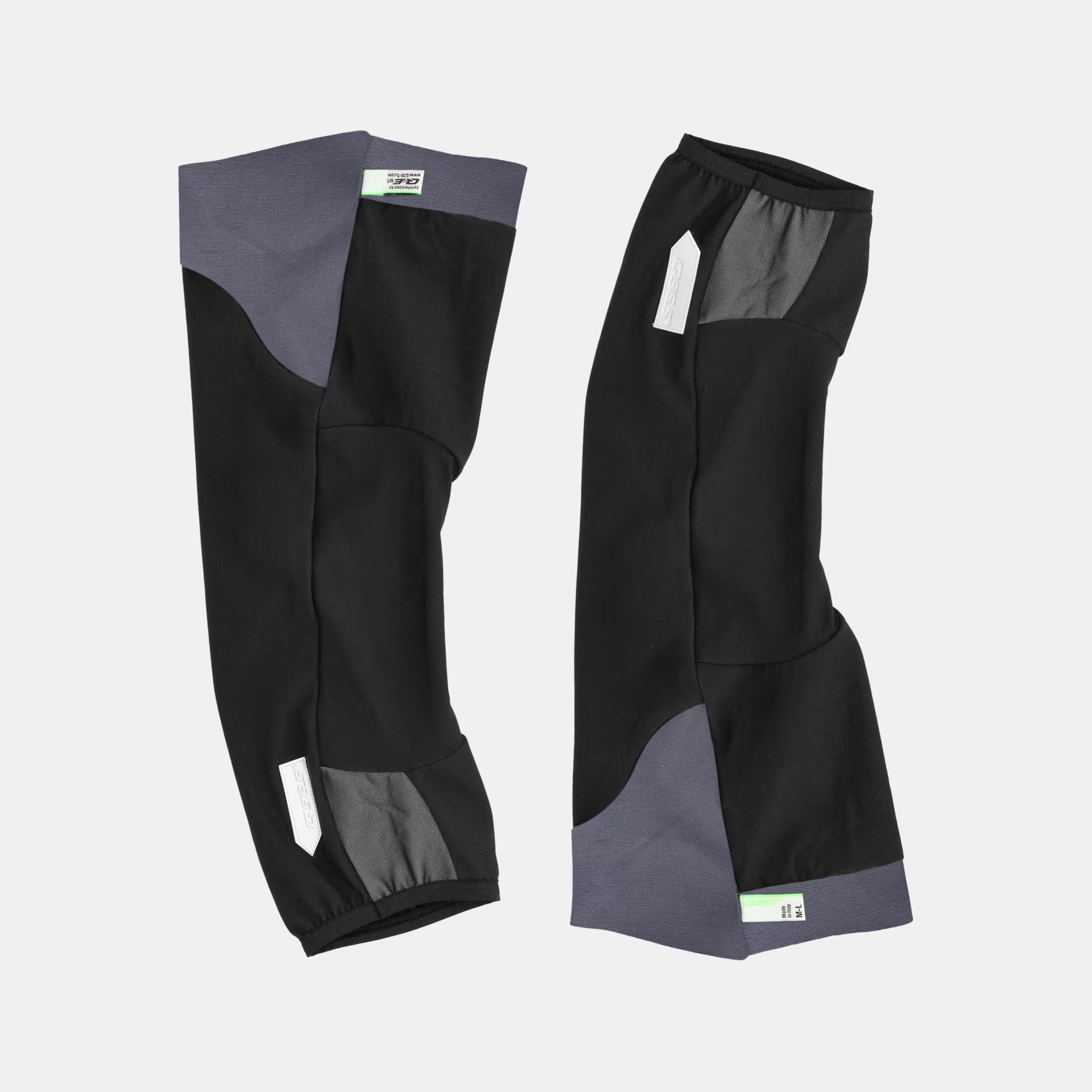 Q36.5 WoolF Knee Warmer - Black shown flat with dual-layer fabric and reflective details for low-bulk warmth on rides