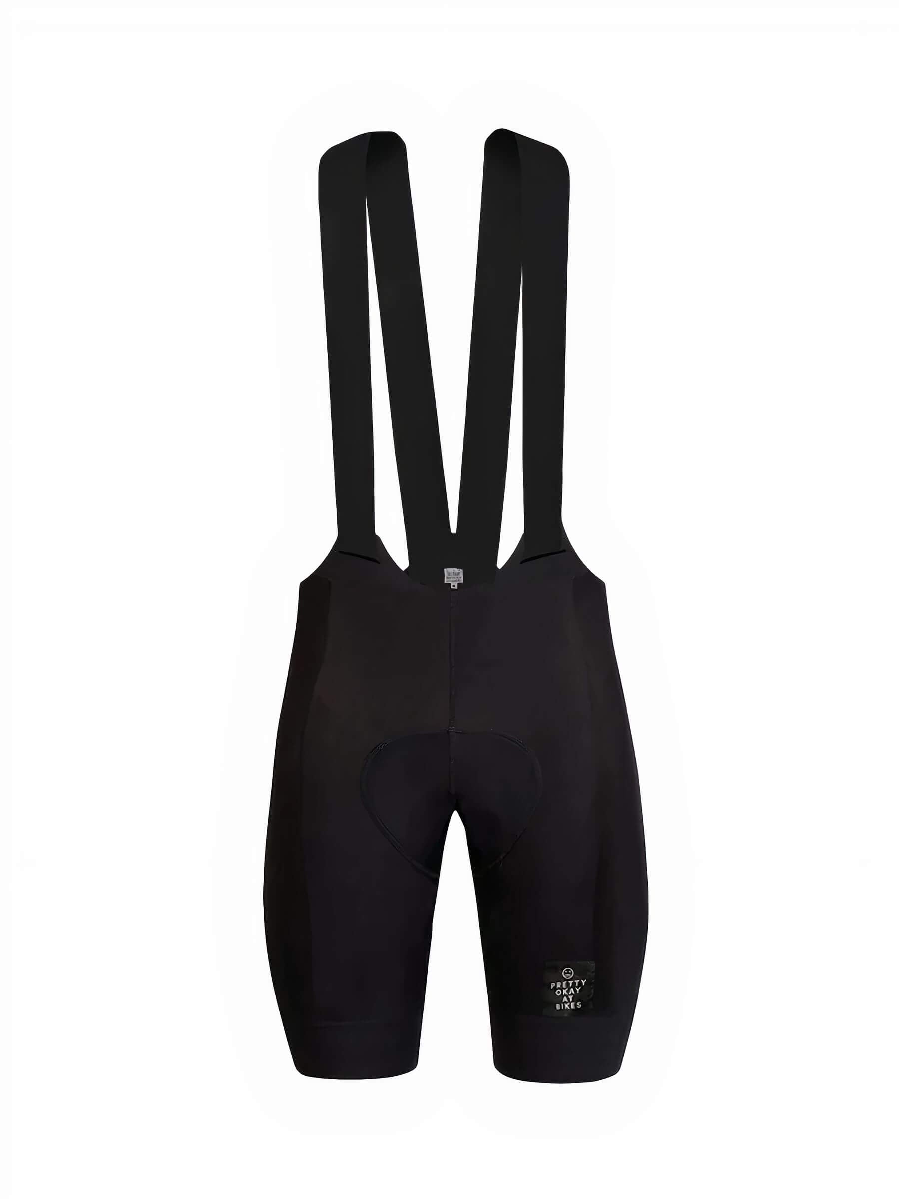 Ostroy NoMad Bibs - Men's in black showing padded seat and wide shoulder straps with minimalist design against white background