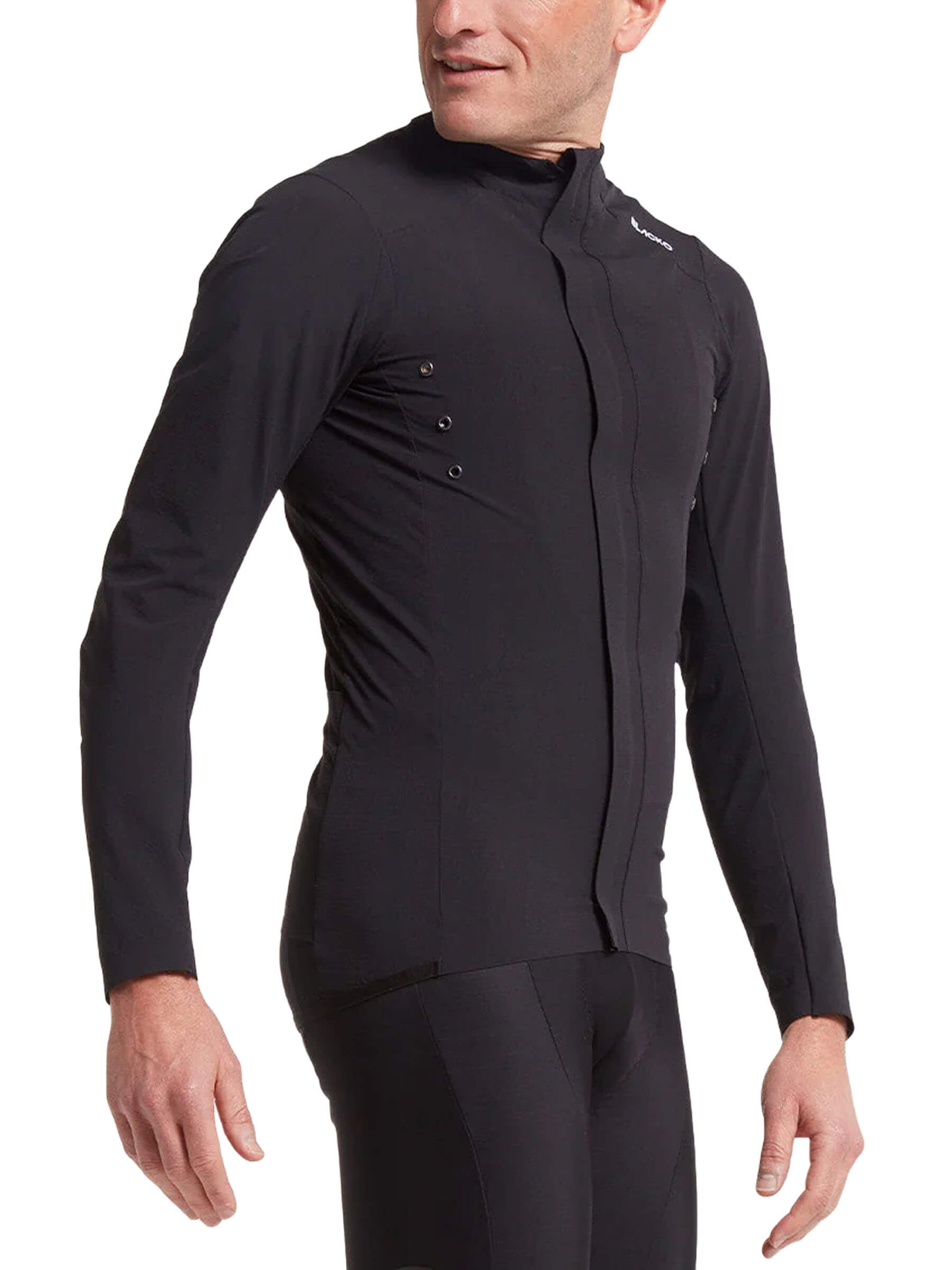 Man wearing Black Sheep Cycling Elements Micro Jacket - Men's in black stretch fabric with water repellent features and high contrast details