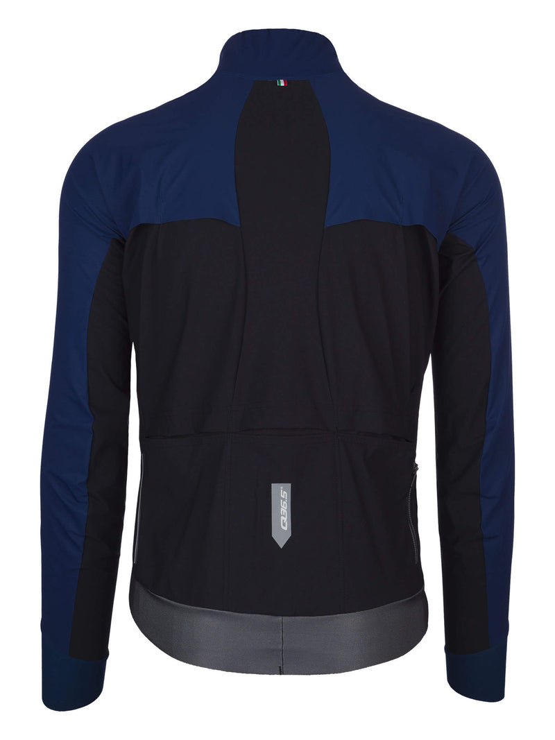 Back view of the blue Q36.5 Bat Shell Long Sleeve Jersey, displaying the reflective logo, ventilation design, and secure fit at the waist.