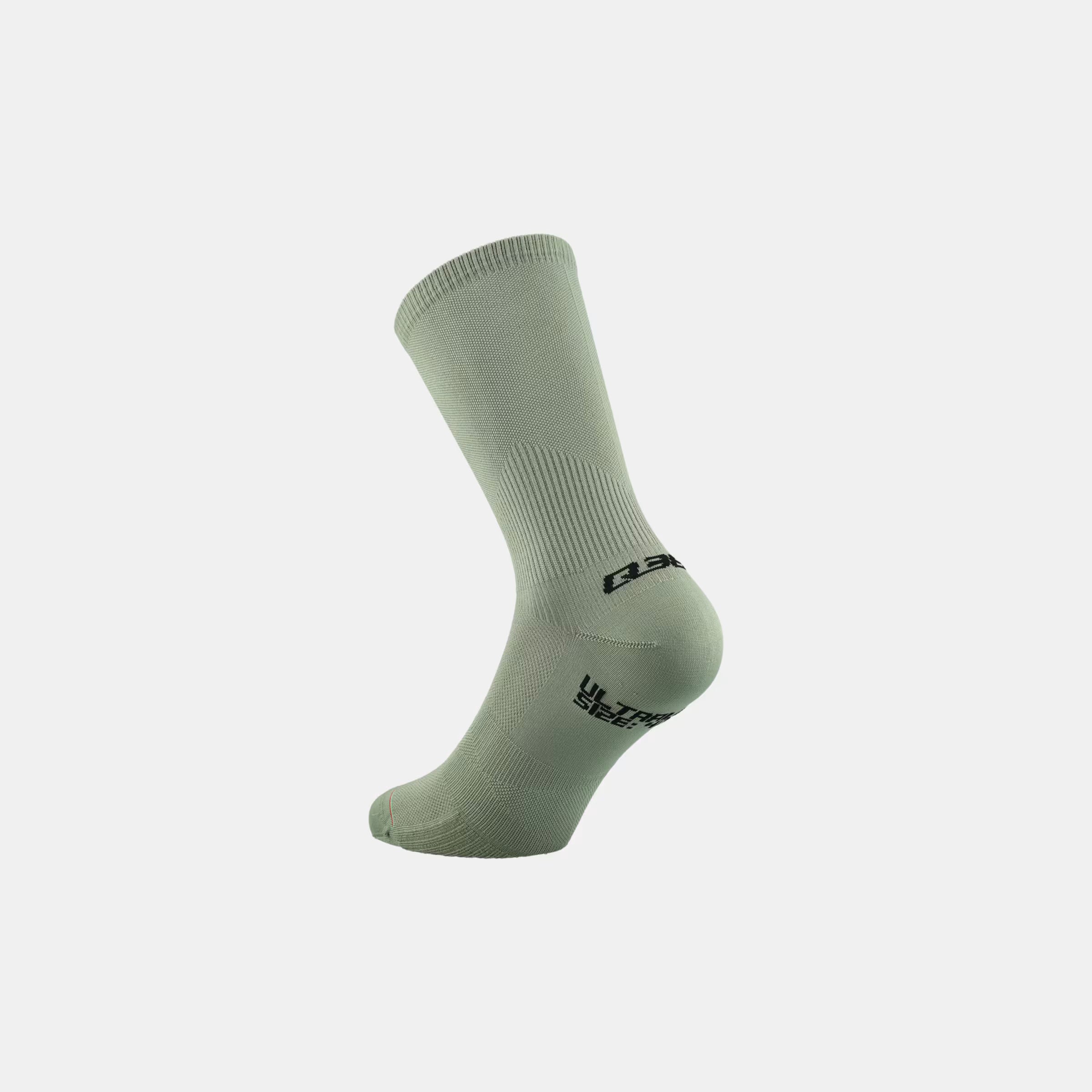 Q36.5 Ultra Long Socks - Sage Green in side view showing knit texture and logo on heel and cuff area