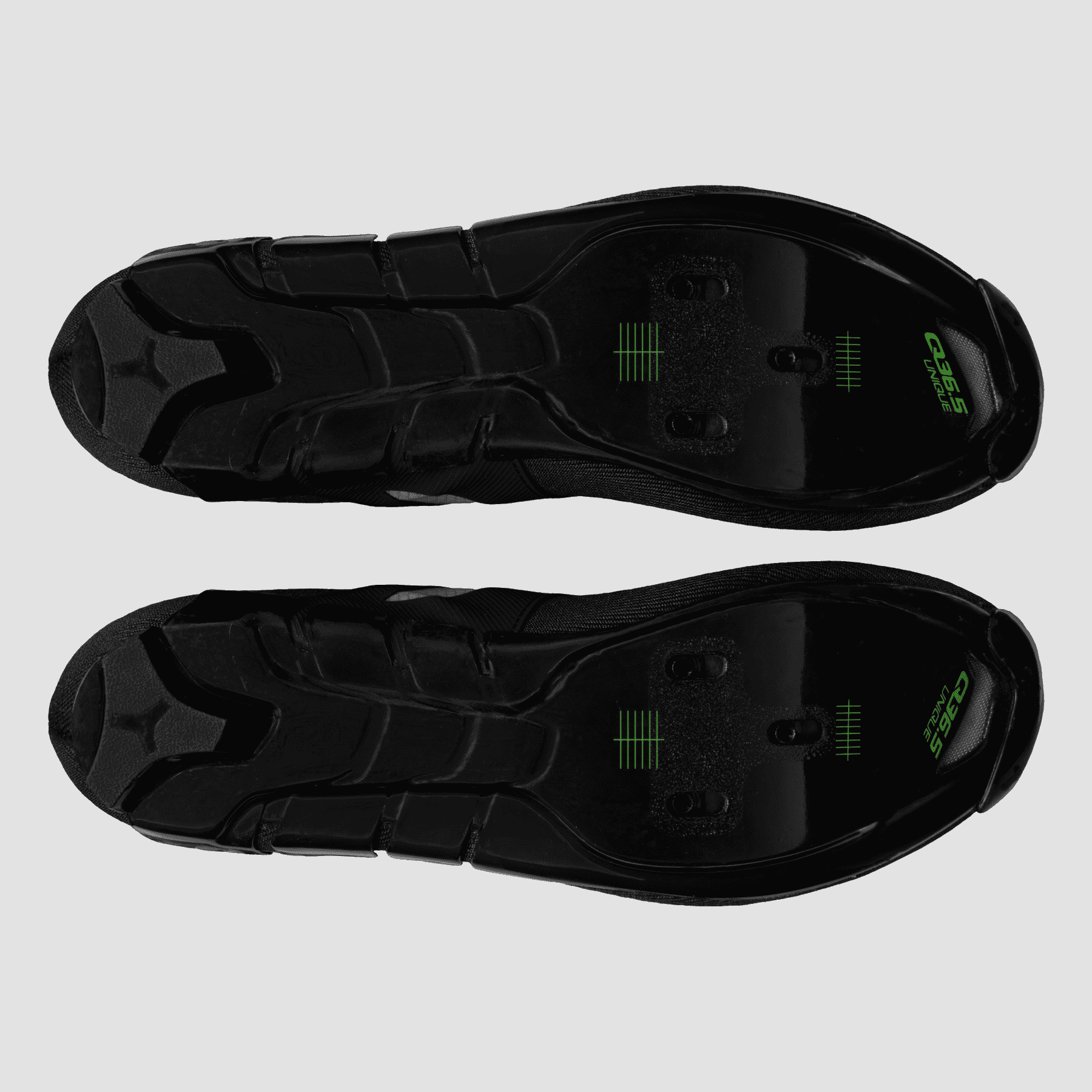 Pair of Q36.5 Dottore Clima Road Shoes - Black showing the detailed sole design and cleat mounting points.