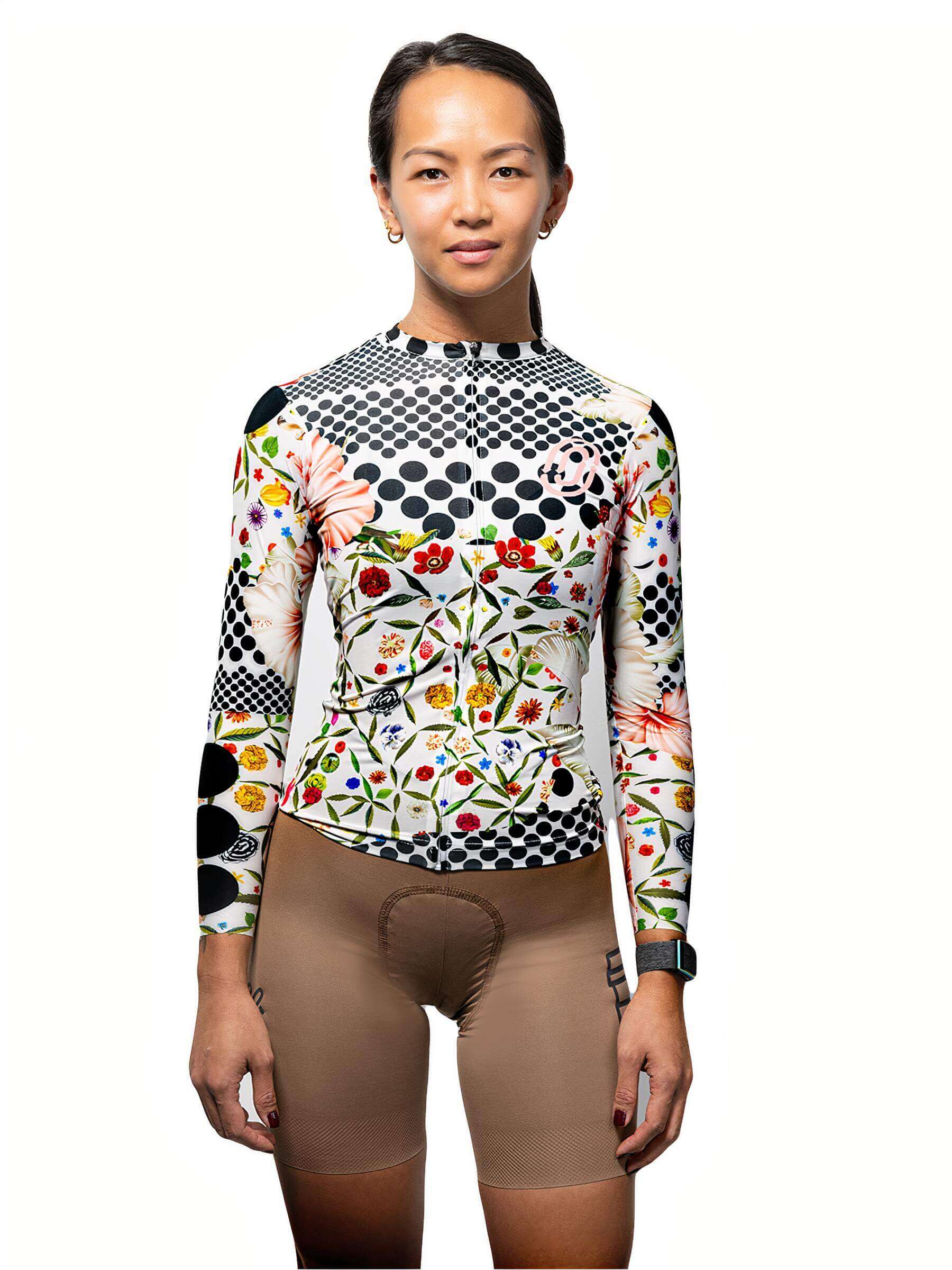 Woman wearing Ostroy Omloop White Lightweight Long-Sleeve Jersey - Women's with floral and polka dot design front view