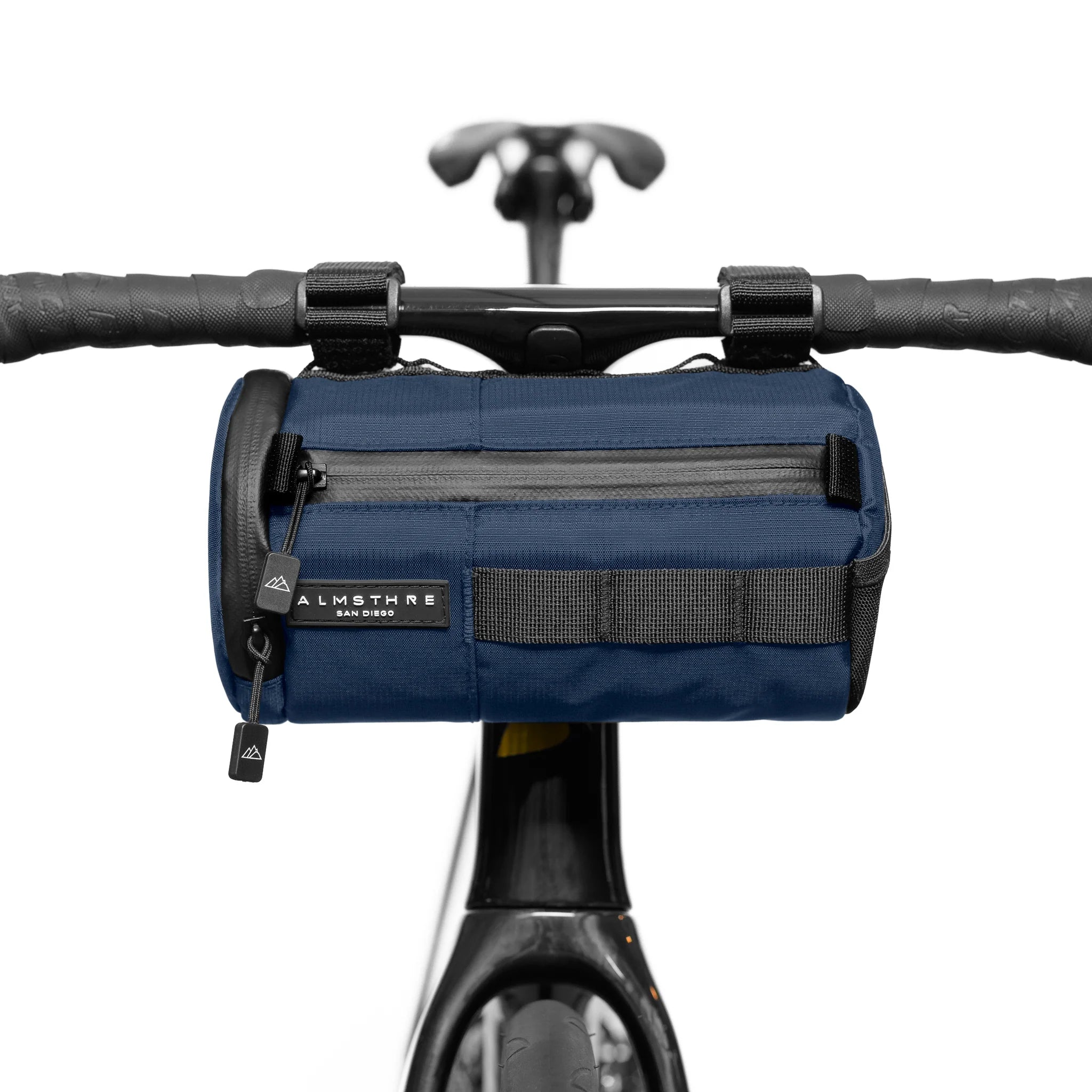ALMSTHRE Signature Bar Bag in navy blue mounted on handlebar with zippered front pocket and sturdy straps