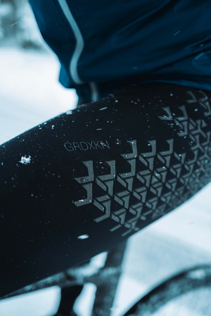 Q36.5 Winter Bib Tights worn during ride, showing fit and protective design.