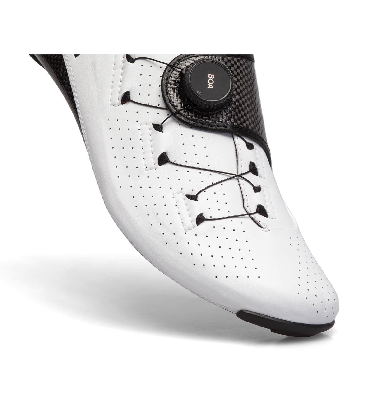 Close-up of white Nimbl FEAT Ultimate cycling shoe showing BOA dial and perforated upper for ventilation