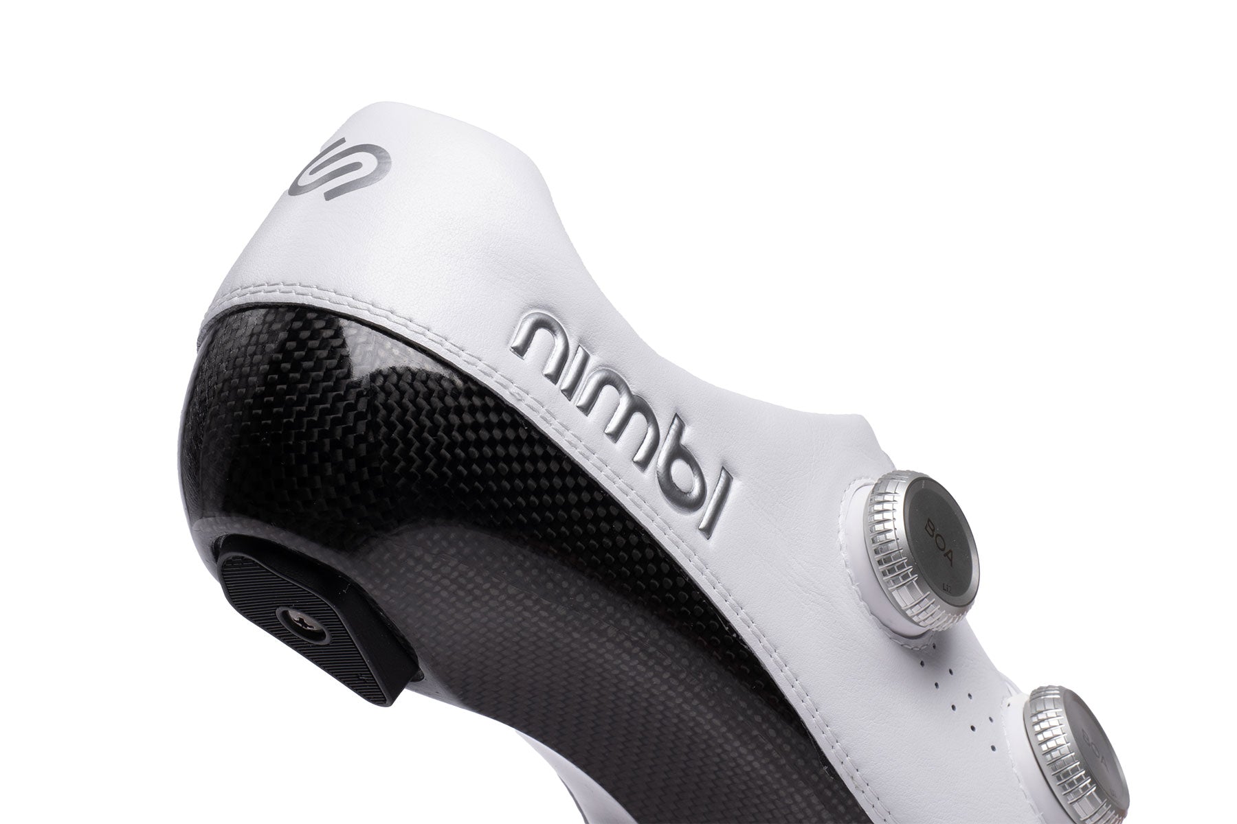 Close-up of Nimbl Exceed Ultimate Glide cycling shoe showing white upper and textured carbon sole detail