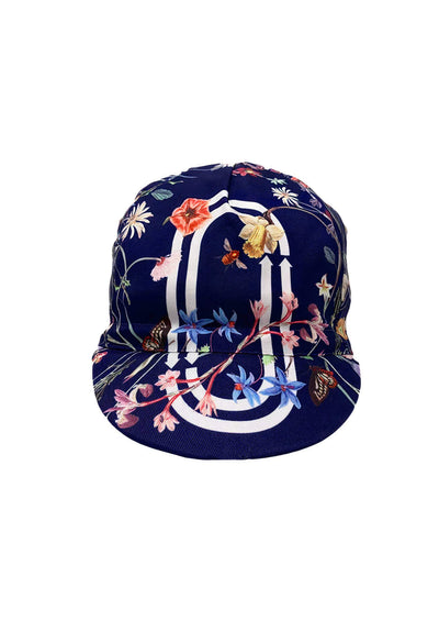 Floral cycling cap with "Ostroy+ NEW YORK" on the brim.