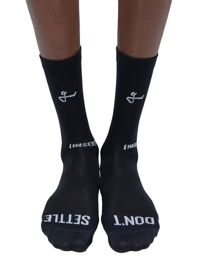 Front view of a pair of black Givelo G-Socks with the brand's logo, designed with a nylon-based fiber for rapid sweat-wicking and dryness.