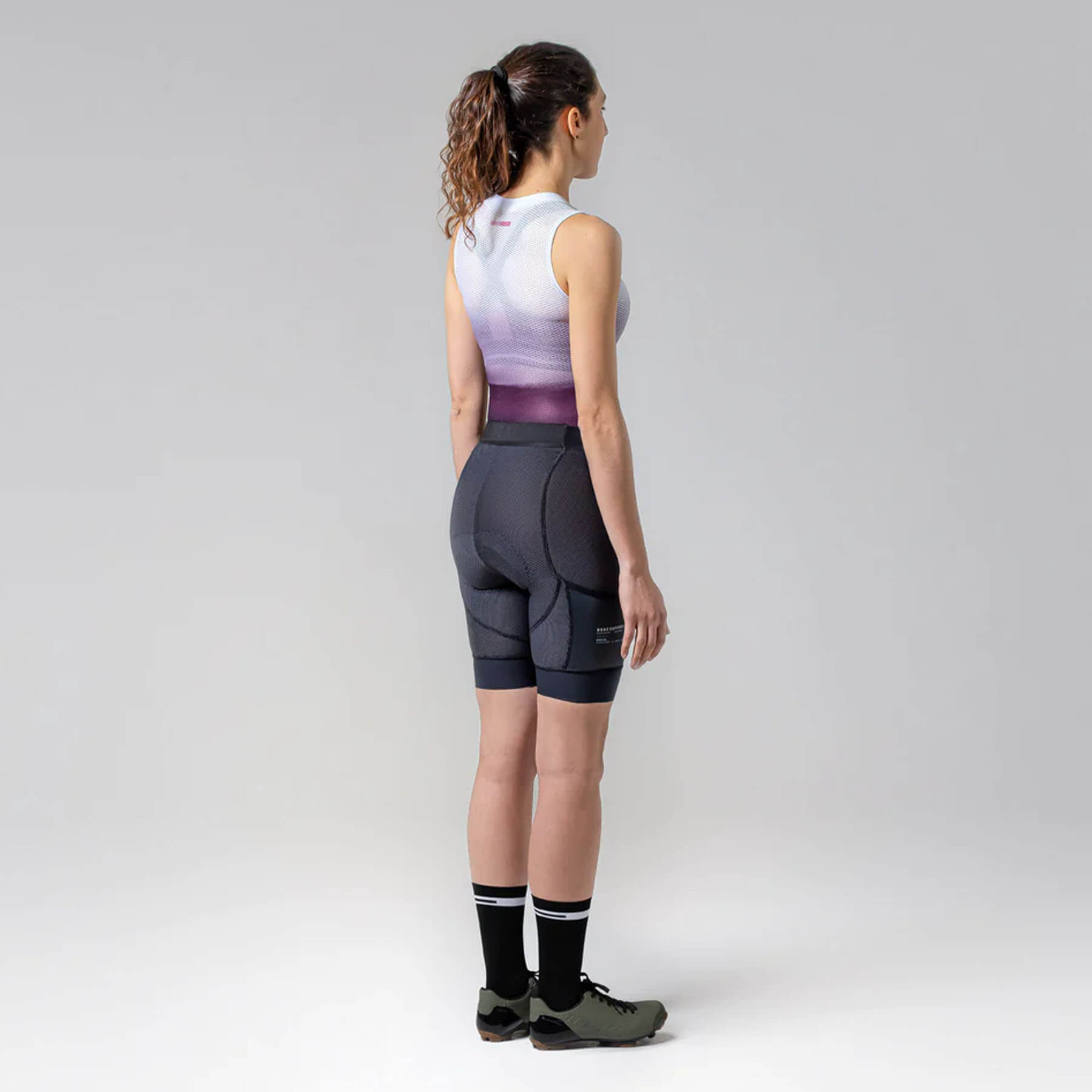 Woman wearing GOBIK Commander Strapless K6 Bib Shorts - Women’s showing back view with side pockets and comfortable fit