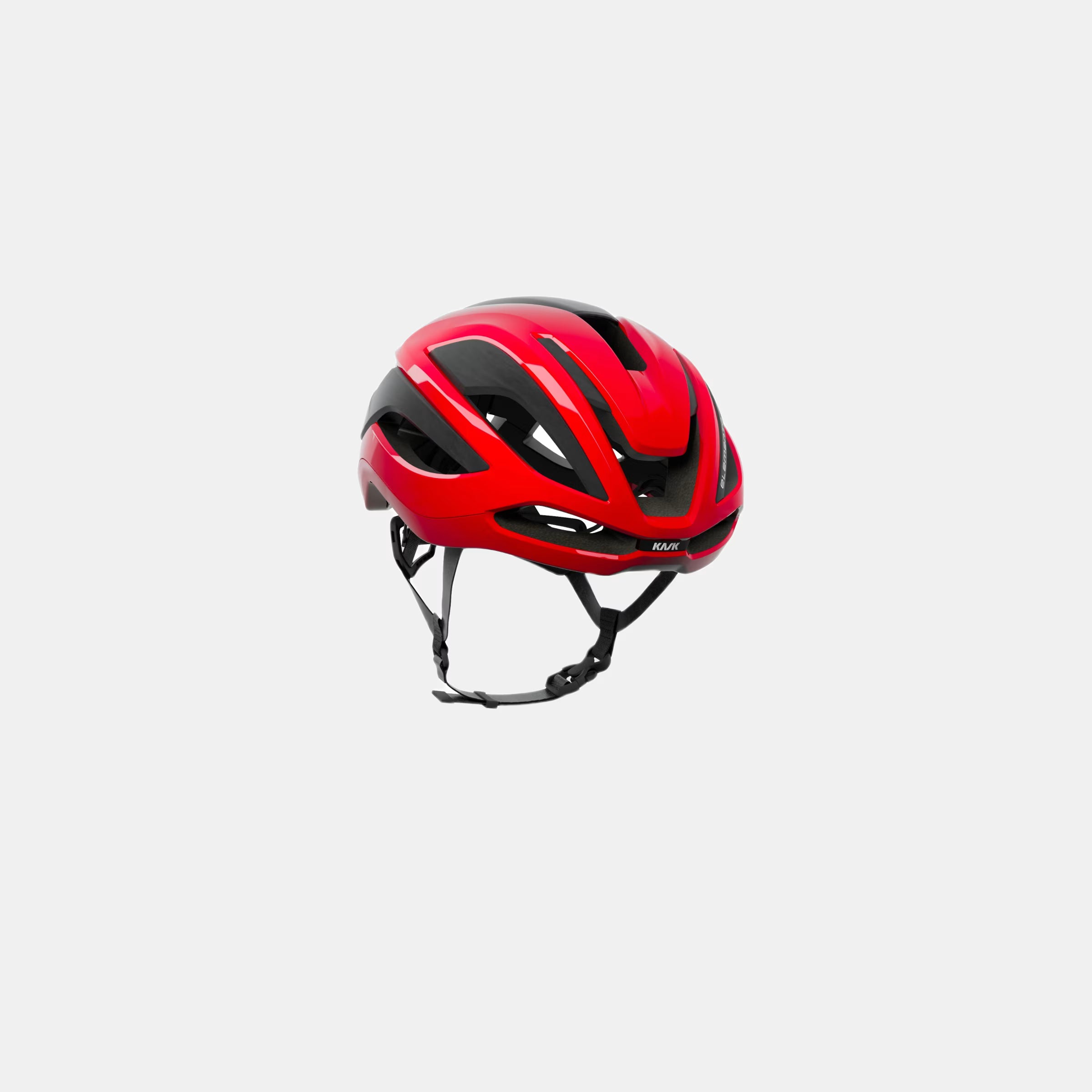 Kask Elemento Helmet  - Red shown front side with aerodynamic vents and adjustable chin straps against white background