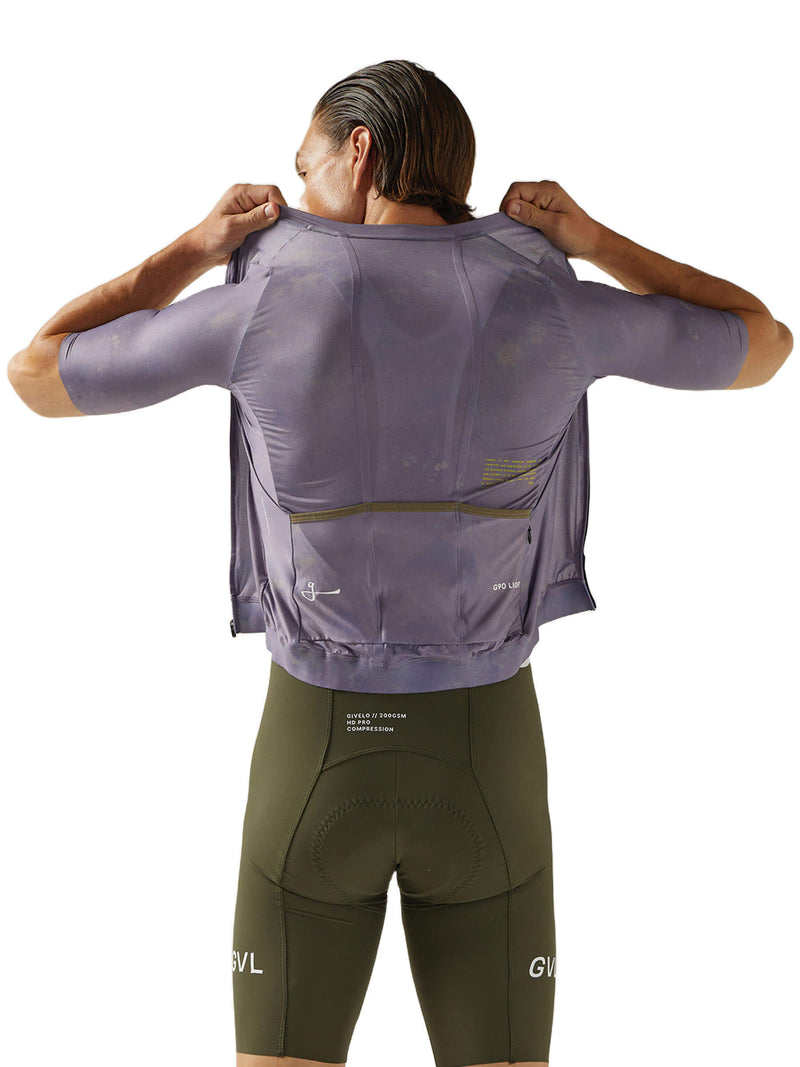Rear view of a Givelo G90 cycling jersey with a waterproof pocket, in soft mauve.