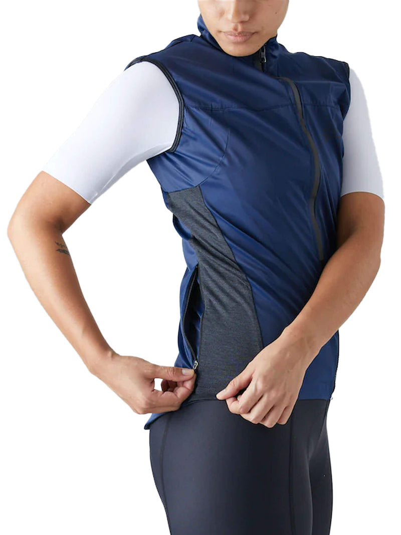 Side view of a blue Givelo Quick-Free Gilet on a cyclist, highlighting the easy pull-off design.