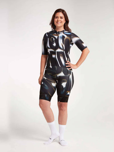 Woman wearing Black and white women's cycling jersey with a print, made of lightweight and soft fabric for a perfect fit.