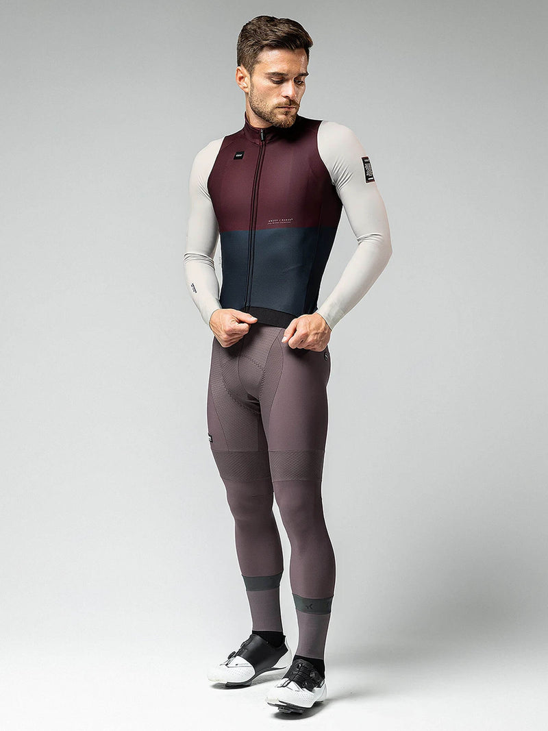 Man in GOBIK Hyder jersey, merlot color, showing hidden zipper and flexible sleeves for cycling comfort.