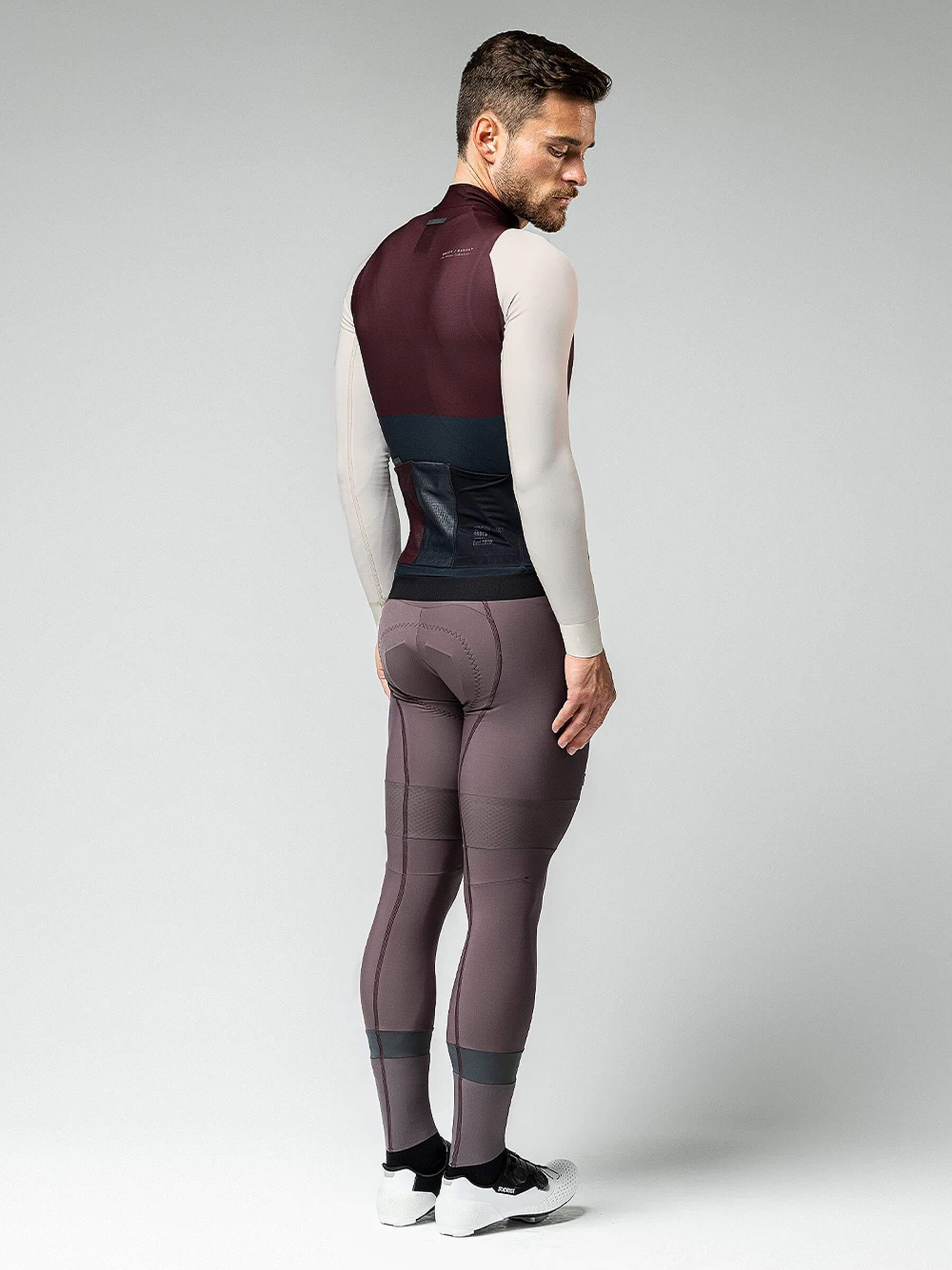 Man in GOBIK Hyder jersey, merlot color, showing hidden zipper and flexible sleeves for cycling comfort.