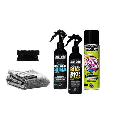 Muc-Off care products and grey microfiber cloth displayed for shoe maintenance.