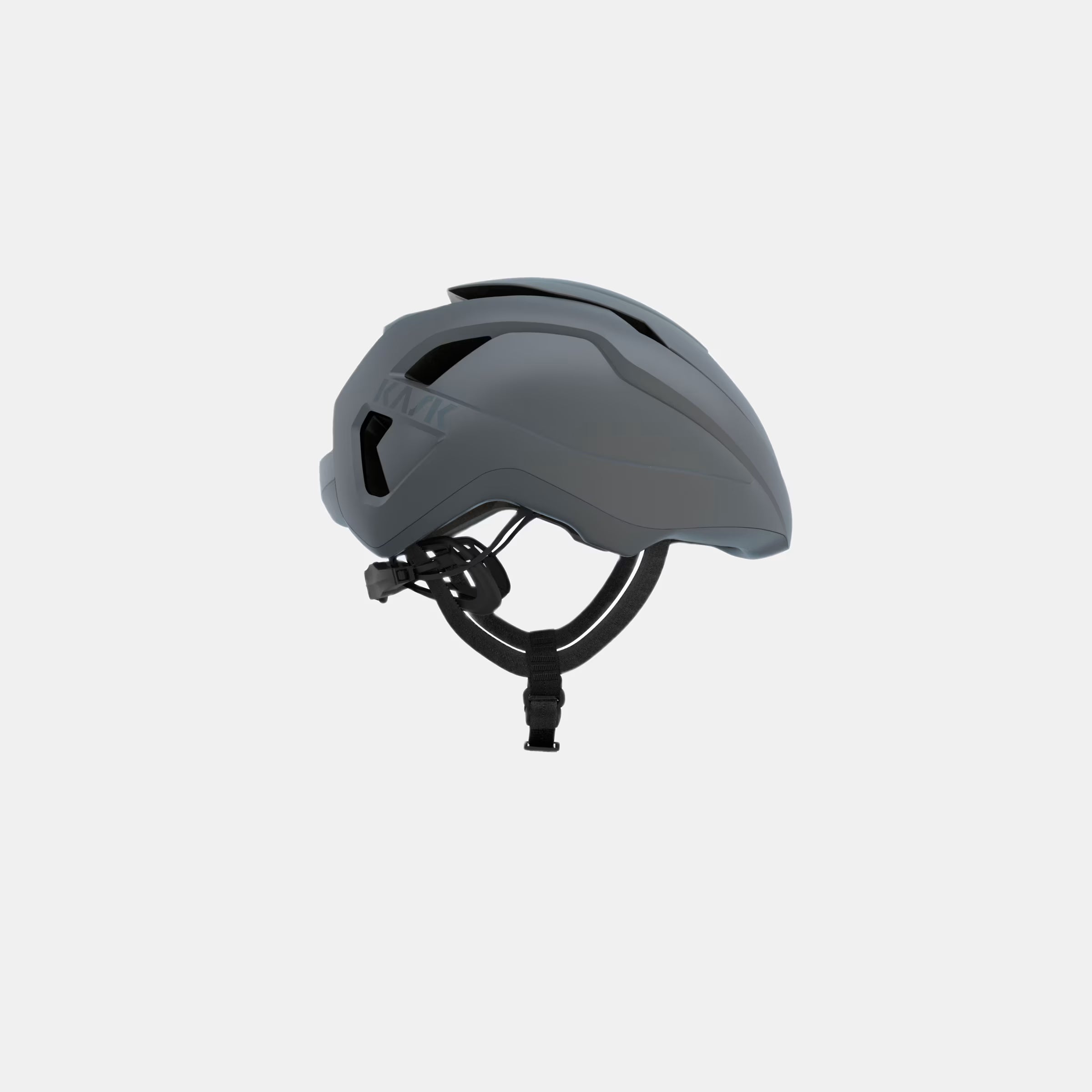 Side view of Kask Wasabi Helmet - Grey Matt showing sleek design and adjustable strap for all-season cycling comfort