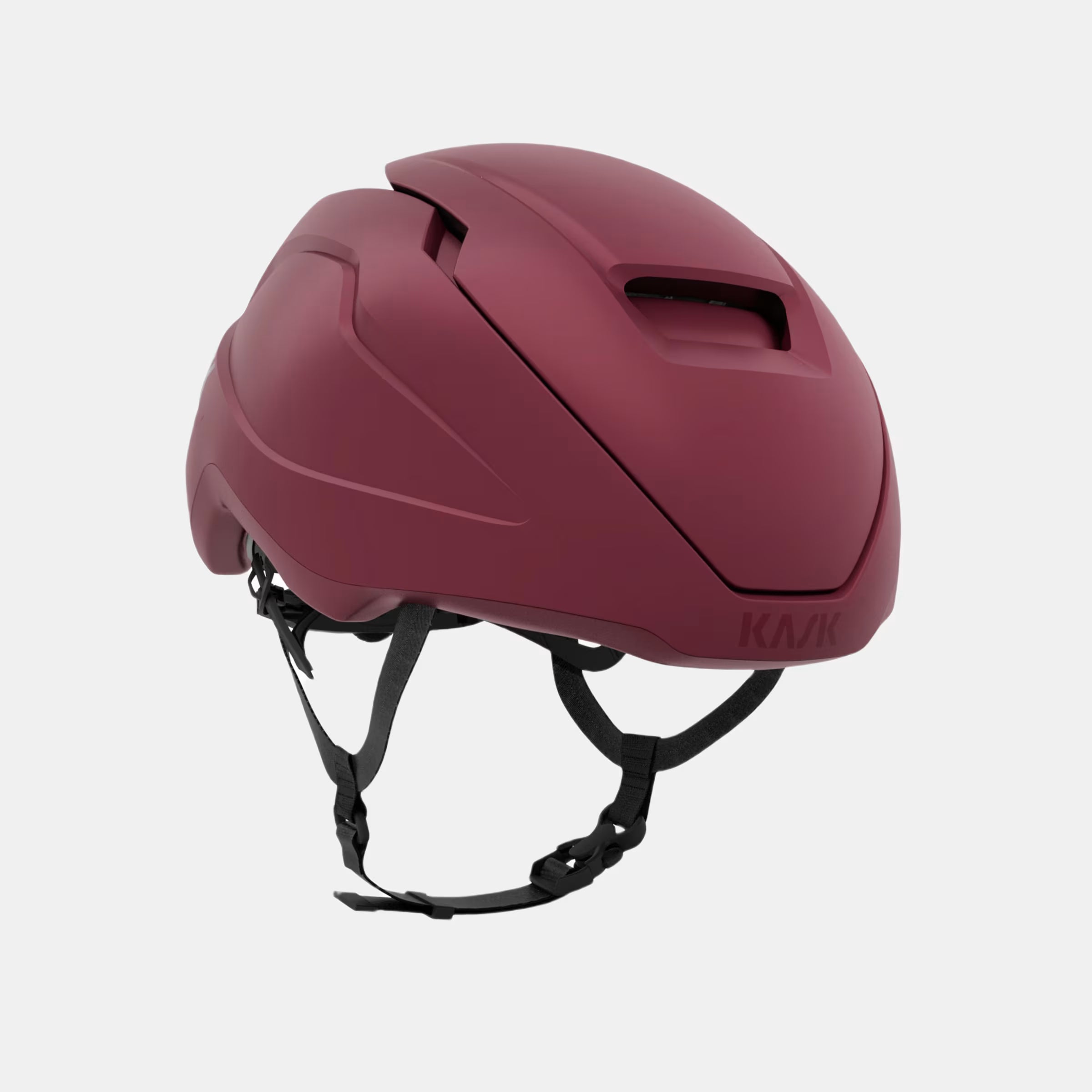 Kask Wasabi Helmet - Burgundy Matt side view showing adjustable vent and sleek aerodynamic design with straps visible