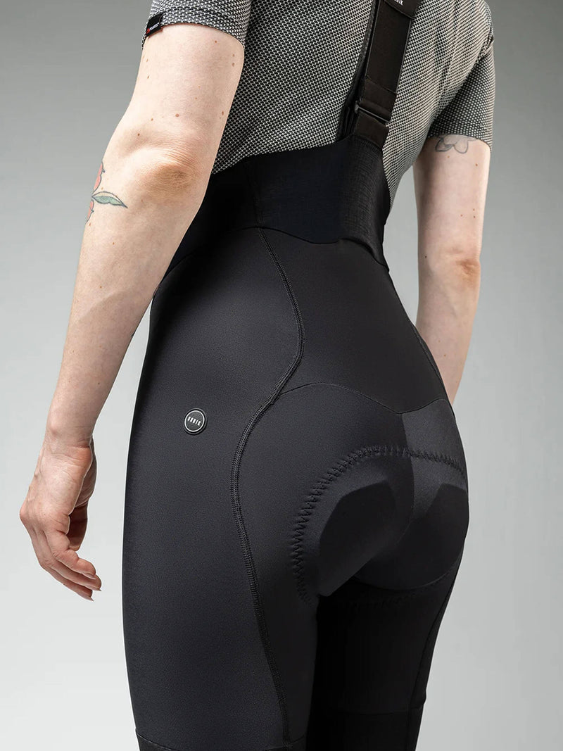 Side view of GOBIK Absolute Black Bib Tights: Showcasing the form-fitting design and technical features for cycling performance.