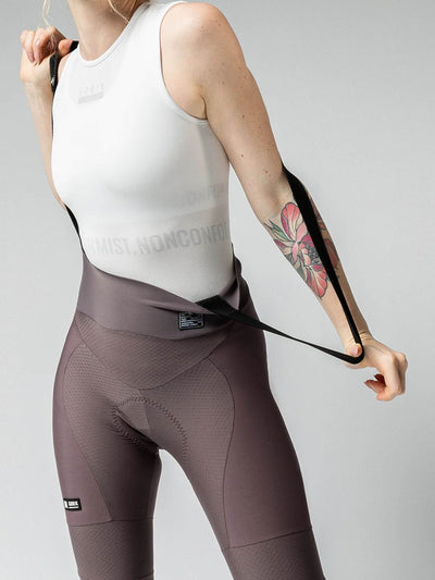 Detail of GOBIK Absolute 6.0 K9 Java Bib Tights: Shows the texture and seat padding, with a white top and a tattoo on the wearer's arm.