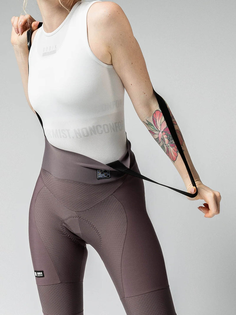 Detail of GOBIK Absolute 6.0 K9 Java Bib Tights: Shows the texture and seat padding, with a white top and a tattoo on the wearer&