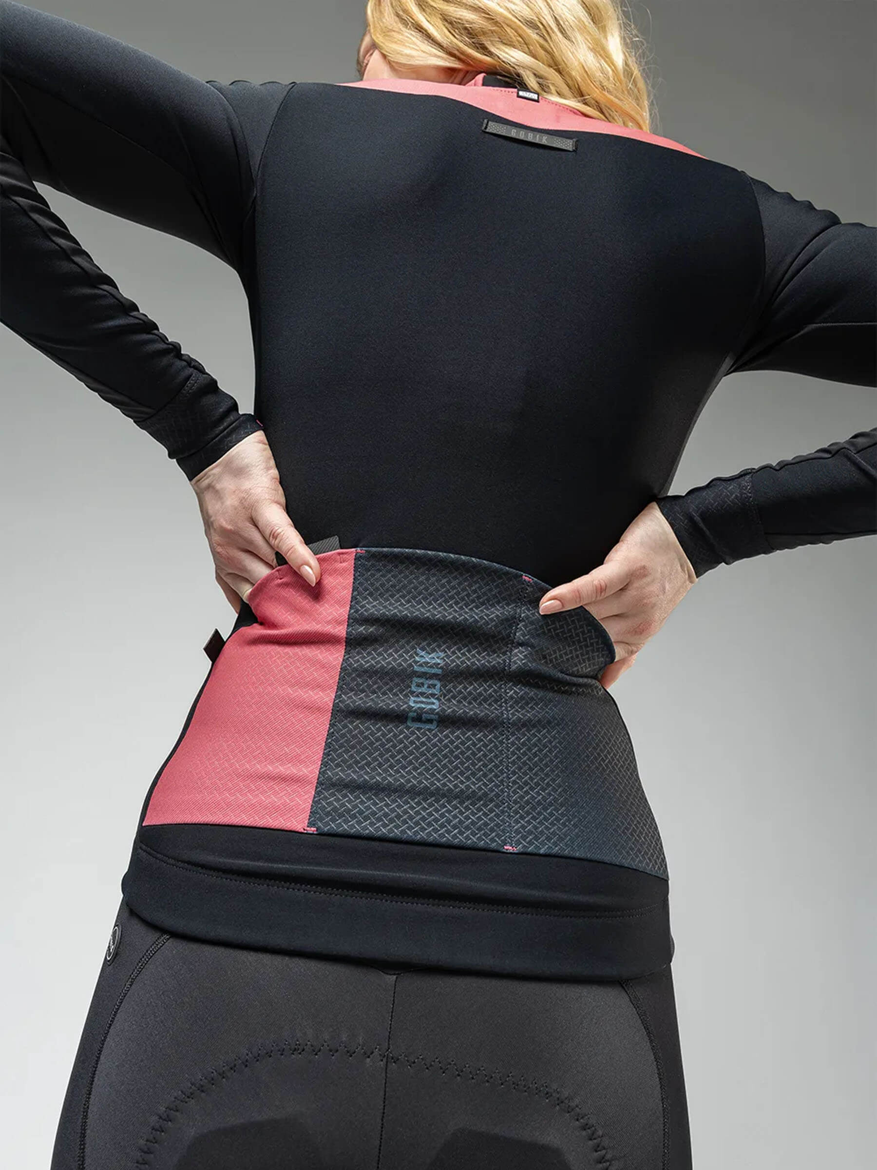 Back view of woman wearing GOBIK Mist Blend 2.0 Jacket - Women's showing tailored fit and color block design