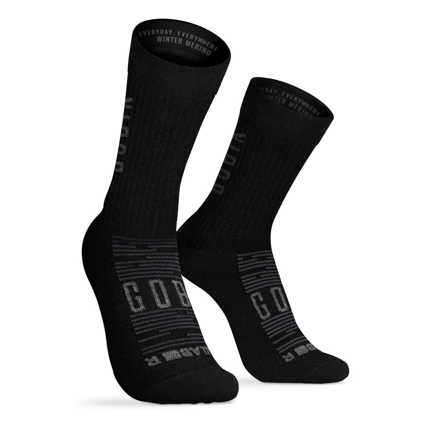 Pair of black GOBIK Winter Merino Socks made from soft natural fibers designed to keep feet warm and regulate temperature.