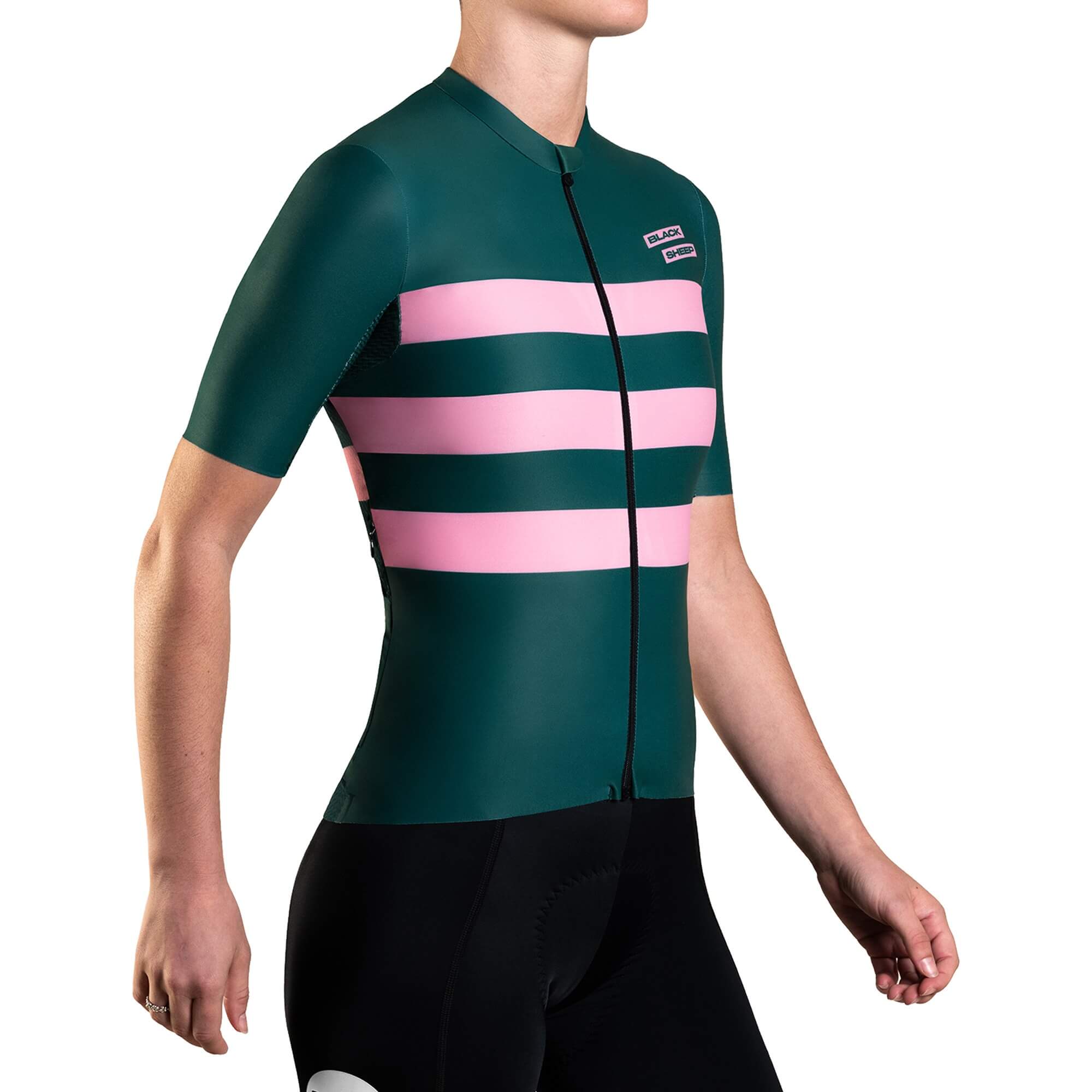 Black Sheep Cycling Women's Classic LTD WMN Jersey in green with pink stripes worn by a female cyclist standing sideways