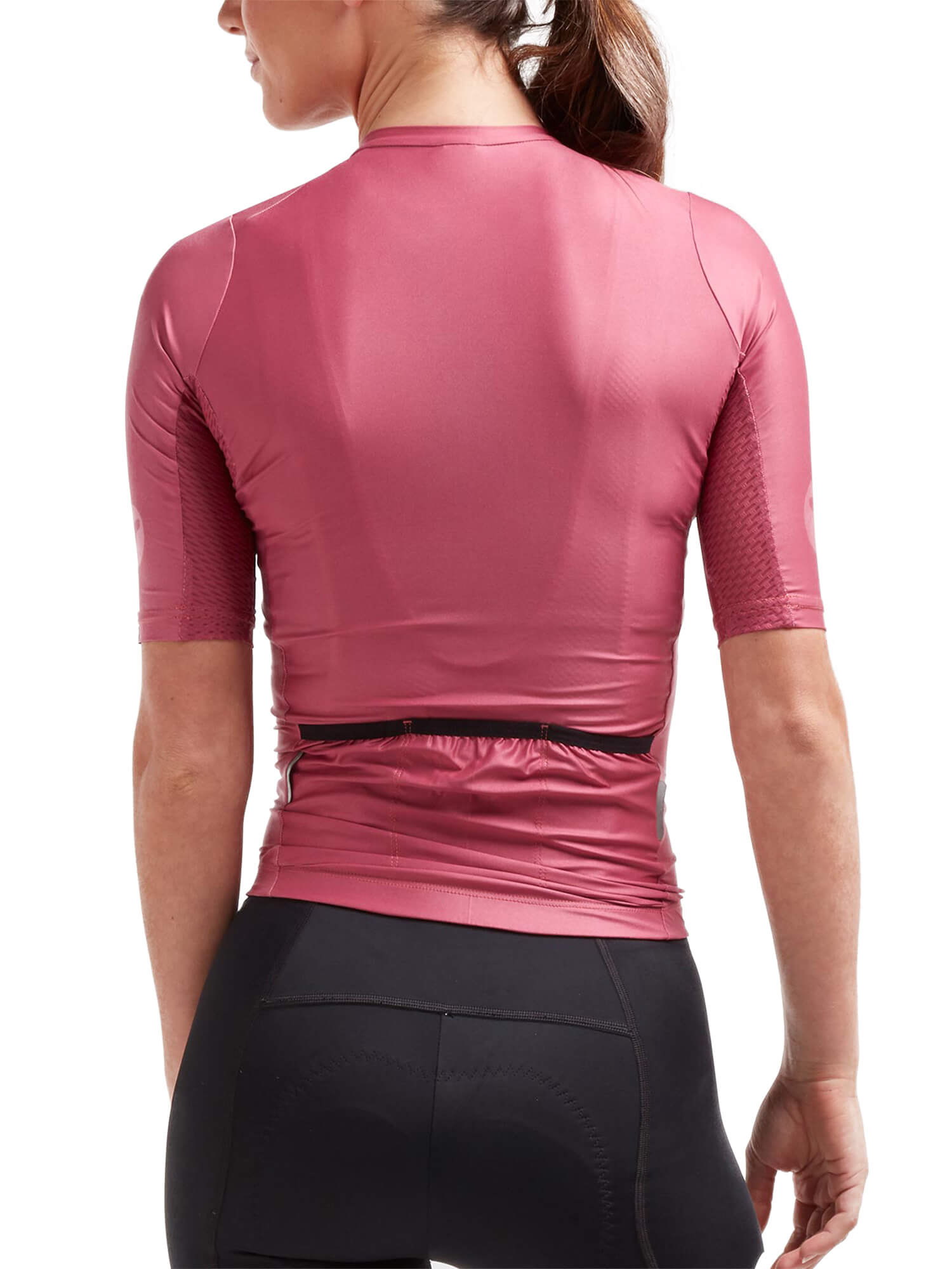 Back view of a cyclist wearing Black Sheep Cycling Essentials TEAM Jersey - Women's in pink with black shorts