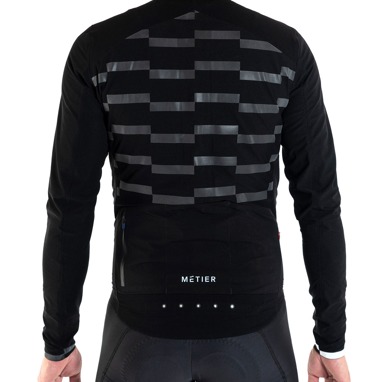Back view of Metier Beacon Jacket with integrated LED lights and reflective panels on black cycling apparel