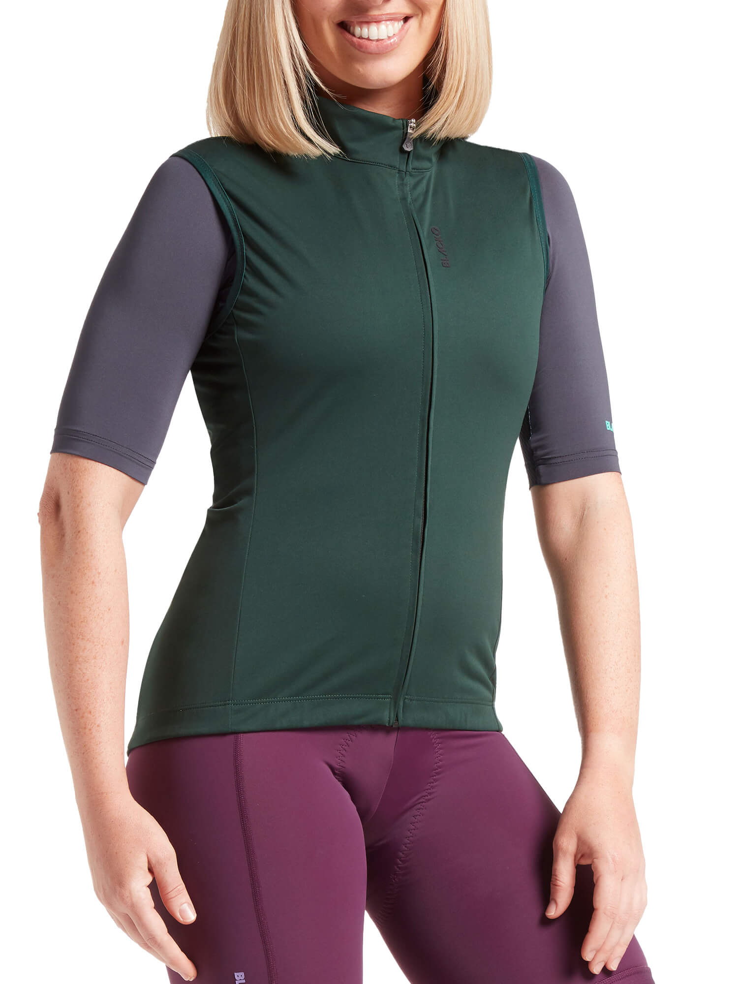 Woman wearing Black Sheep Cycling Essentials TEAM Vest SS22-Women's with purple leggings and gray sleeves on white background