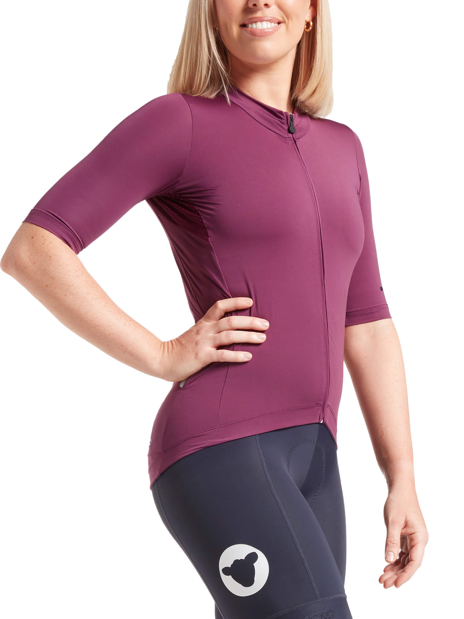 Woman wearing Black Sheep Cycling Essentials TEAM Jersey SS22- Women's in purple with half sleeves and fitted silhouette
