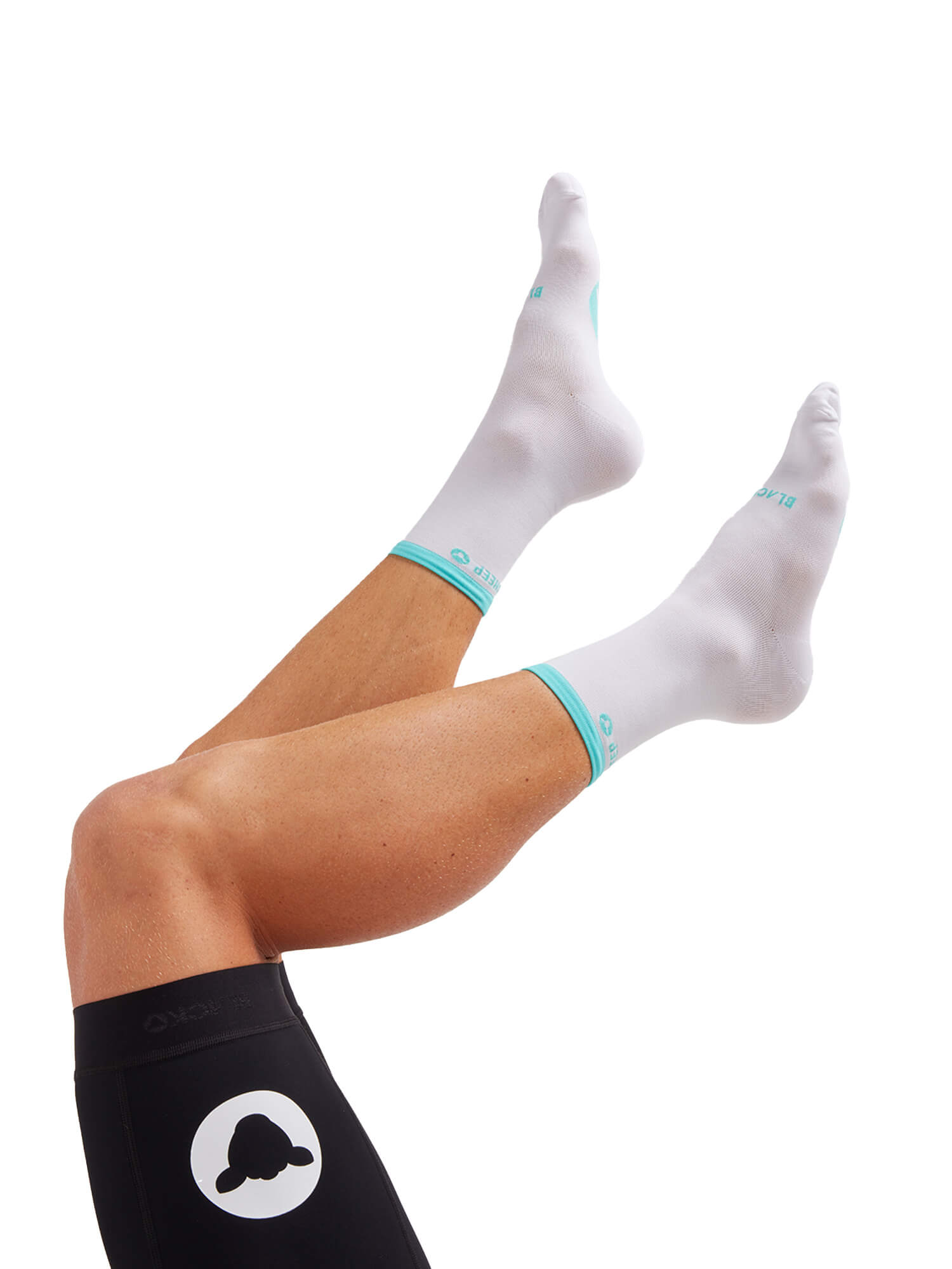 Black Sheep Cycling Perfect Crew Stripe Socks in white with turquoise trim worn on raised legs against white background