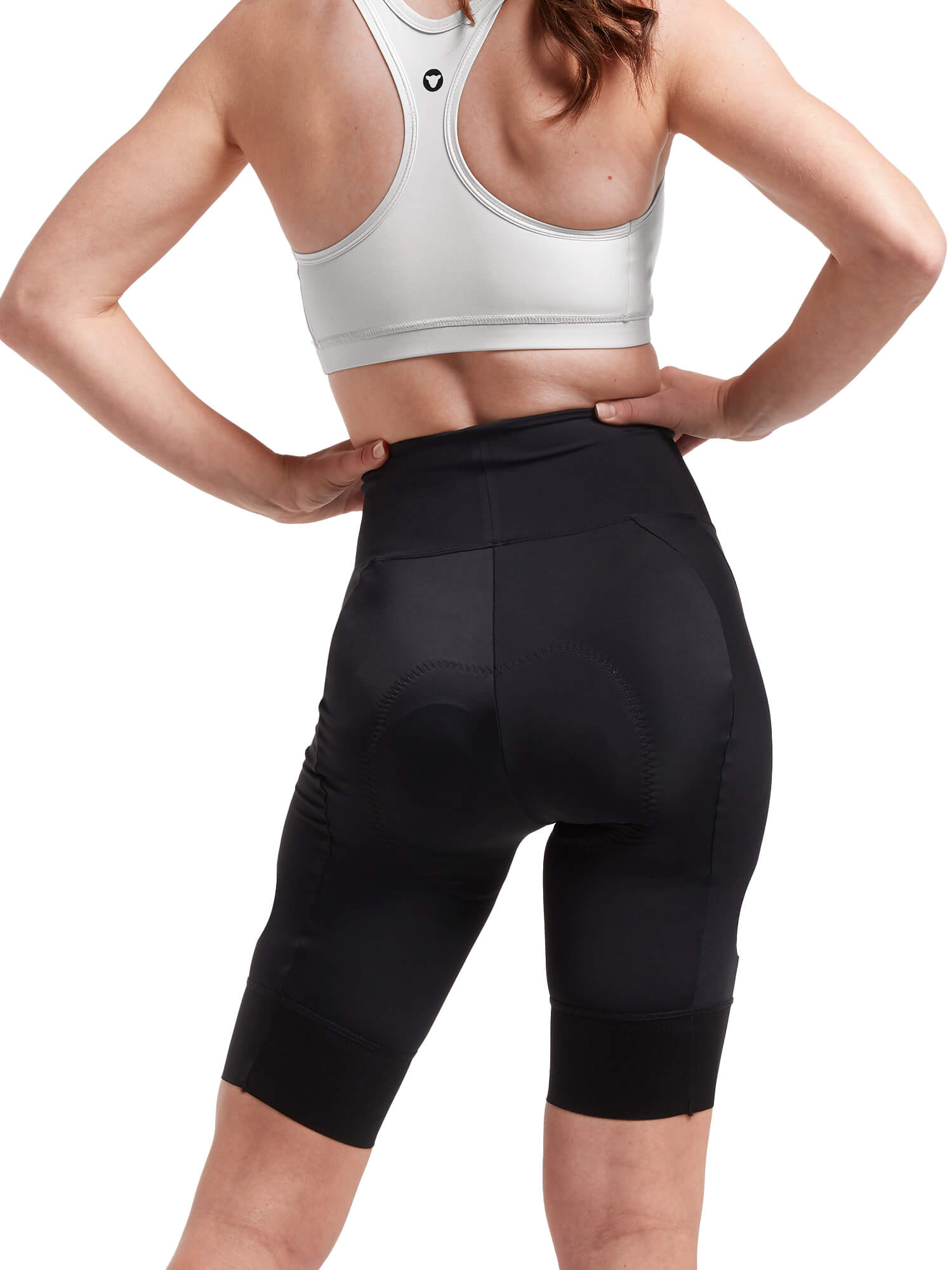 Rear view of a woman wearing Black Sheep Cycling Essentials TEAM Shorts - Women paired with a white sports bra