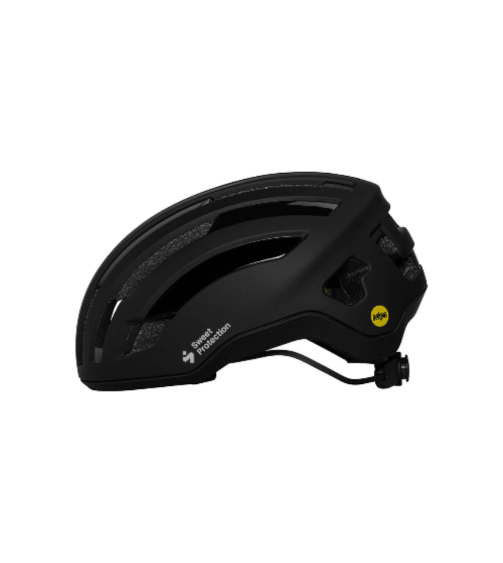 Side view of Sweet Protection Outrider Mips Helmet in black with ventilation and adjustable rear dial system